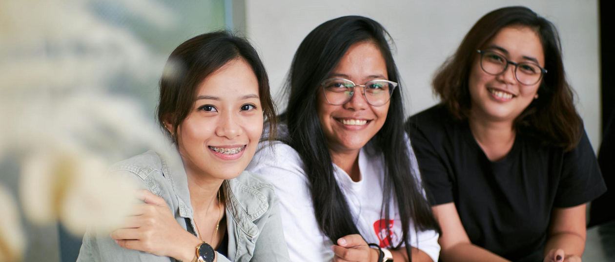 Asian women posing for a photo.